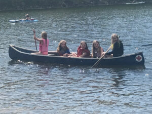 Five girls in a canoe.